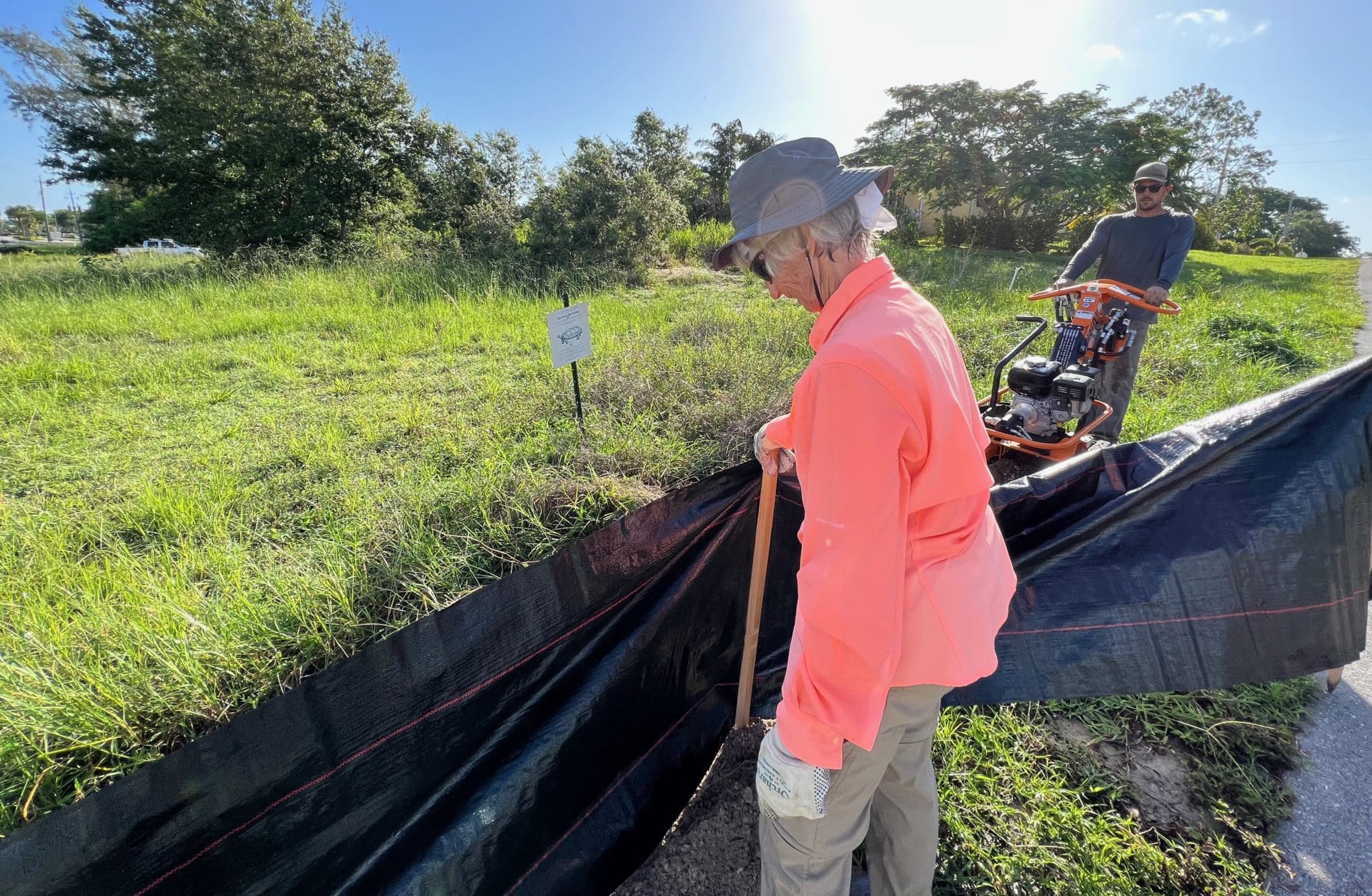 Conservancy of Southwest Florida volunteer, Pat…. Works with the team to align the fencing.