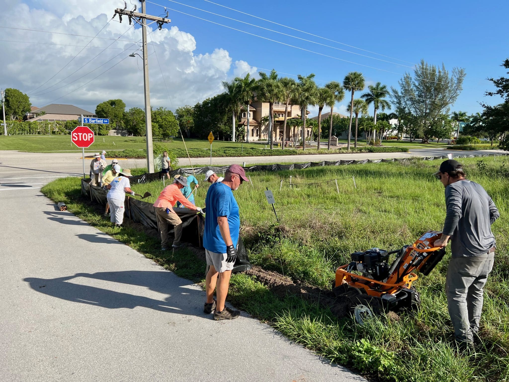 The corner of Hawaii Drive and South Barfield Ave has been a troublesome area for the tortoises. The team works in tandem to get the fencing secured.